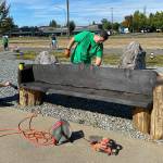 Volunteers in Buckley touched up a Foothills Trail bench during its 2020 event. Photo courtesy Amy Molen
