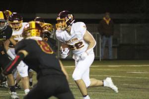 Jacob Rennaker, No. 22, is in the running for the starting QB position with the WRHS Hornets; he's pictured here at the 2021 Battle of the Bridge game against Enumclaw. Photo by Ray Miller-Still
