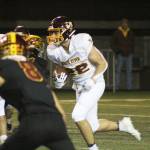 Jacob Rennaker, No. 22, had to fight to be this years starting QB against Aaden Rathbun; hes pictured here at the 2021 Battle of the Bridge game against Enumclaw. Photo by Ray Miller-Still