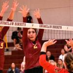 The Enumclaw High volleyball team opened the season September 6 with a hard-fought, home-court victory over the Orting Cardinals. Above, Sam Darby and Ailianna Quaempt are looking for a block; below, winding up for a serve is Lexie DeGroot. Photos by Kevin Hanson