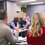 Enumclaw School District Business Director Kyle Fletcher presents additional bond data to the school board and Superintendent Shaun Carey. Photo by Ray Miller-Still