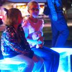 Many city officials, staff, and community members also attended the event, including Penny and Lucy Chevassus, seen here sitting on the blue bench. Photo by Ray Miller-Still