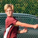 Enumclaw High's Noah Nuttle returns a serve during his Oct. 6 victory over Fife's Tre Sims. The two battled in a No. 1 singles match. Enumclaw went on to defeat the visiting Trojans 3-2. Photo by Kevin Hanson