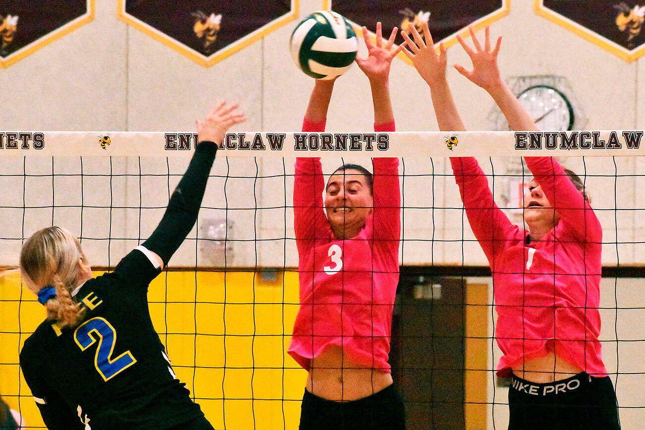 The Enumclaw High girls remained deadlocked atop the South Puget Sound League 2A standings with an Oct. 13 victory over the visiting Fife Trojans. In this photo from Chuck Smith Gymnasium shows strong net play are Samantha Darby (3) and Bella Firnkoess. Photo by Kevin Hanson