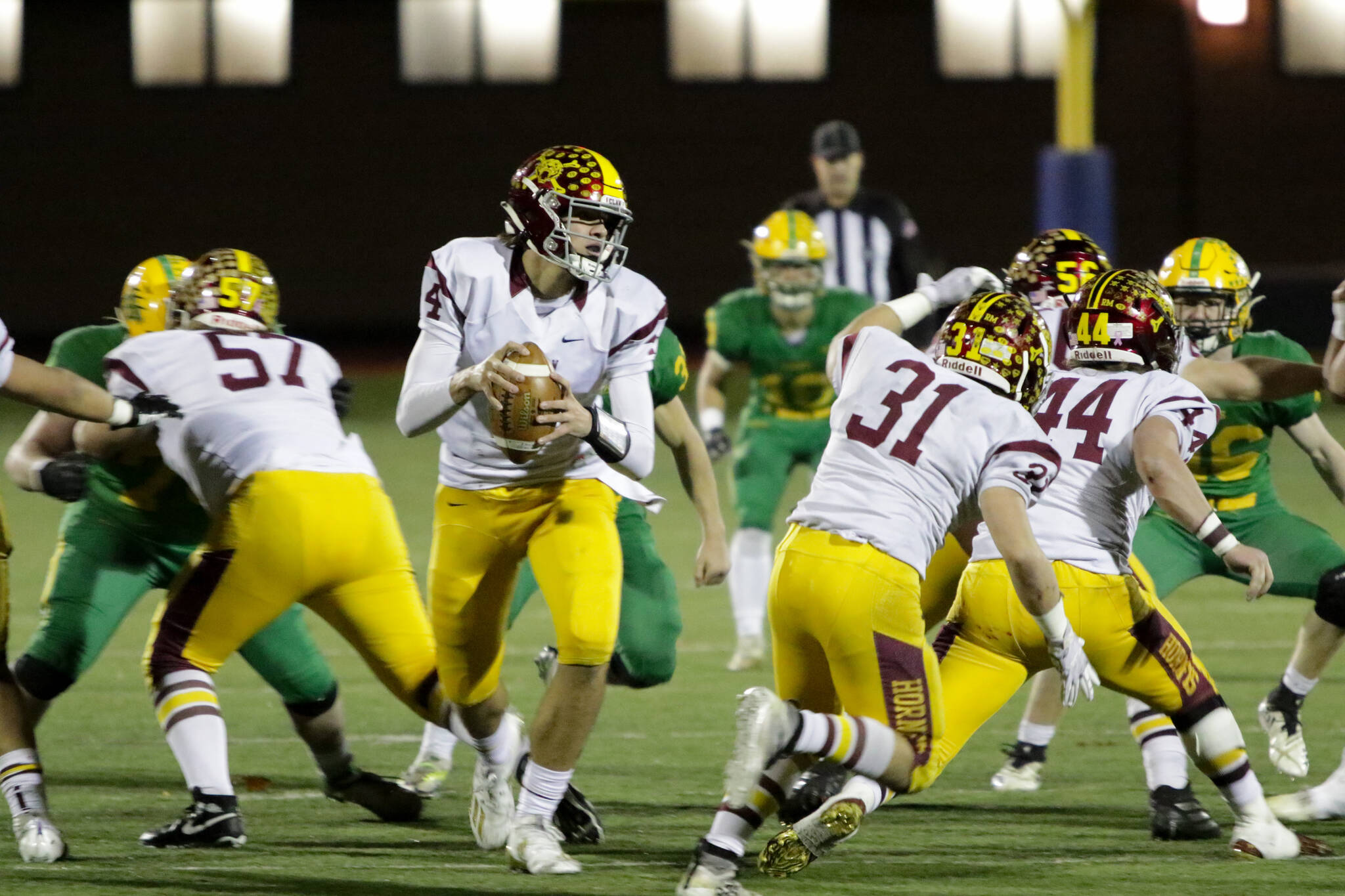 Photo courtesy Todd Overdorf / sonscapeimages.com/home
EHS was unstoppable; Lynden, immovable. In the end, one team had to give, and the Hornets were finally defeated after a stunning season. Pictured is quarterback Gunnar Tarachte looking to push through the Lions defenses.