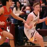 FILE PHOTOs BY KEVIN HANSON 
Enumclaw Highs Noah Seabrands drives to the hoop during a game last season against the Orting Cardinals. Now a senior, Seabrands earned second team, all-league honors a year ago.