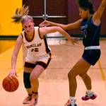 In these photos, Hornet senior Gabi Martel (12) drives past a Pasco defender. Photo by Kevin Hanson