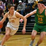 In the Buckley gym, junior Tyce Donovan (11) races past a Clover Park defender. Photo by Kevin Hanson
