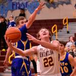 Helping his Enumclaw High team to a victory over the Fife Trojans was senior Ty Hanson (22), shown here working to score under the basket. Photo by Kevin Hanson