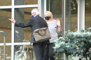 Photo by Ray Miller-Still 
Joann Thomas and her attorney Terrence Kellogg exit the U.S. District Court building in Seattle following her conviction in the drainage district trial.