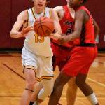 Rylan Ramos (13) passes to an open teammate. Photo by Kevin Hanson