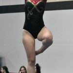 Pictured is Aislinn Binder on beam. Photo by Kevin Hanson