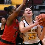 Ally Green (23) gets fouled during a drive to the hoop during a Jan. 6 game. Photo by Kevin Hanson