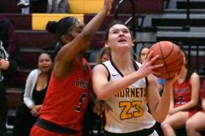 Ally Green (23) gets fouled during a drive to the hoop during a Jan. 6 game. Photo by Kevin Hanson