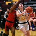 Ally Green (23) gets fouled during a drive to the hoop during a Jan. 6 game. Photo by Kevin Hanson