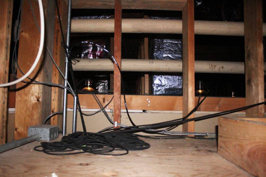 … and crawl through this space, sometimes as far as 70 feet. A new performing arts center would have better access to lights, and would allow theater tech students to be hands-on with them. Photos by Ray Miller-Still