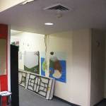 There were no buckets catching leaks when this photo was taken, but you can see the water damage that has eroded the ceiling and walls around the auditorium. Photo by Ray Miller-Still