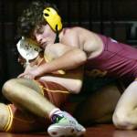 PHOTOS BY KEVIN HANSON
The White River High boys' wrestling team hosted Enumclaw and Franklin Pierce on Jan. 18, defeating both South Puget Sound League 2A opponents. In these photos, WR's Hunter Oswold (yellow headgear) gets the better of his EHS opponent and Jacob Balliet prepares to pin his Franklin Pierce foe. For detailed results and team scores, see Sports Roundup.