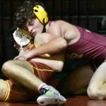The White River High boys wrestling team hosted Enumclaw and Franklin Pierce on Jan. 18, defeating both South Puget Sound League 2A opponents. In these photos, WRs Hunter Oswold (yellow headgear) gets the better of his EHS opponent. Photo by Kevin Hanson