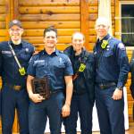 Firefighter Ryan Rodenberg (middle). Photo by Ray Miller-Still