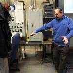 Photo by Ray Miller-Still 
Byron Kibler custodian Ken Sneen showing how his office and work space occasionally floods, either with water coming in from the outside or a defunct pump in the back.