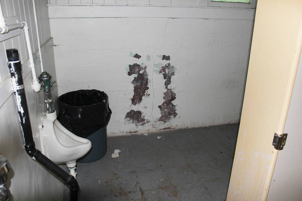 The away bathrooms under the Expo Center Fieldhouse, like the locker rooms, are dark, small, and in disrepair. Photo by Ray Miller-Still