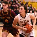 PHOTOS BY KEVIN HANSON
The hoop edition of the Battle of the Bridge was played out over the course of two nights last week. The Hornet-Hornet girls' game was contested Thursday and the boys tussled the following evening; both victories went to the home-court Enumclaw teams. In these photos, Enumclaw's Karson Holt drives to the hoop and White River's Dakota Sprouse does the same.