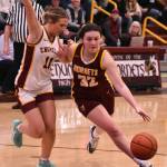 PHOTOS BY KEVIN HANSON The hoop edition of the Battle of the Bridge was played out over the course of two nights last week. The Hornet-Hornet girls game was contested Thursday and the boys tussled the following evening; both victories went to the home-court Enumclaw teams. In these photos, Enumclaws Karson Holt drives to the hoop and White Rivers Dakota Sprouse does the same.
White Rivers Dakota Sprouse tried to get around an Enumclaw defender. Photo by Kevin Hanson