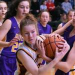 Enumclaws Kalee Swanson wrestles for a loose ball during Saturdays victory over the Columbia River Rapids. 
Photo by 
Kevin Hanson