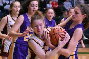 Enumclaws Kalee Swanson wrestles for a loose ball during Saturdays victory over the Columbia River Rapids. 
Photo by 
Kevin Hanson