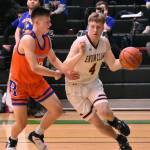 Enumclaw guard Noah Seabrands drives to the hoop during the Hornets Saturday afternoon victory over Ridgefield High. Photo by Kevin Hanson