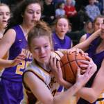 Enumclaw's Kalee Swanson wrestles for a loose ball during Saturday's victory over the Columbia River Rapids. Photo by Kevin Hanson
