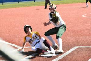 White River's Kennedy Selander, pictured here scoring a run during district action last spring, will be found at second base for the Hornets. Now a junior, she was a first team, all-league selection a season ago. Photo by Kevin Hanson