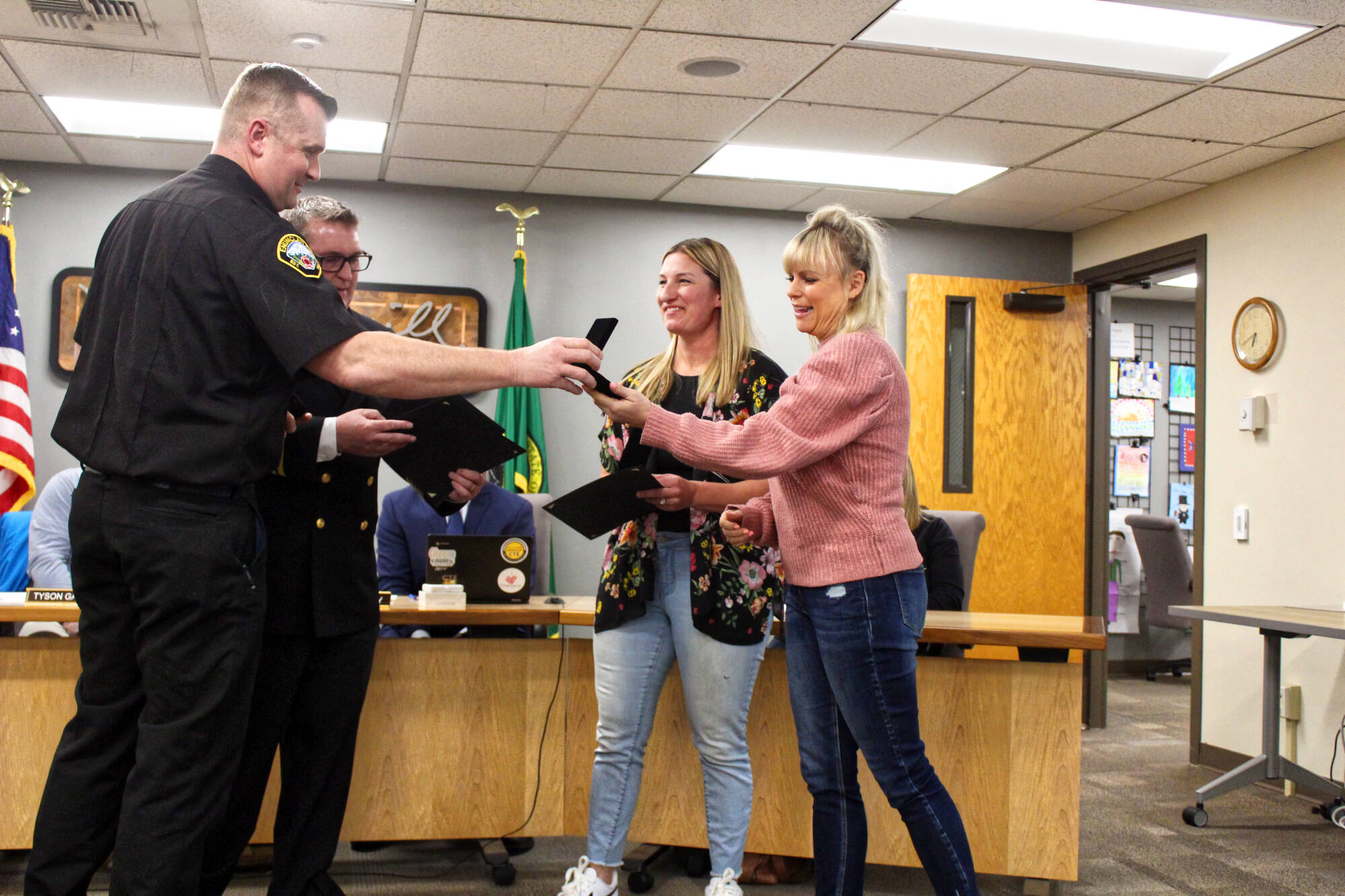 Photo by Ray Miller-Still
Enumclaw Fire Chief Randy Fehr and Deputy Chief Ben Hayman awarding Beth Madill and Lissa Strecker with their Citizen Lifesaving Awards.