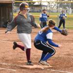 White Rivers Ellie Friis beats out an infield hit. Photo by Kevin Hanson