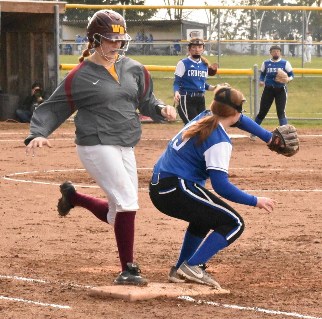 White Rivers Ellie Friis beats out an infield hit. Photo by Kevin Hanson