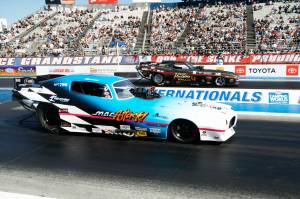 Photo courtesy NHRA-National Dragster
Pictured is the car Mac Attack right before taking off in the final race at the at the Lucas Oil Winternationals. If you look closely, you can see the back tire compressing against the pavement (the wavy lines) before the car launches at 233 miles per hour.