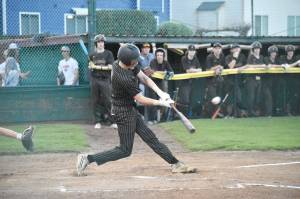 Photo by Kevin Hanson
The regular South Puget Sound League 2A season has wrapped up for most spring sports and postseason play awaits. Pictured here during a recent Enumclaw High School home baseball game is Casey Megargle putting a ball into play.