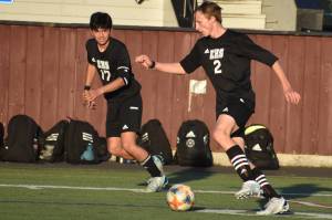 Pictured is Sam Blair (2) and Rishi Burt (17) during an April 28 came against the Orting Cardinals. Photo by Kevin Hanson