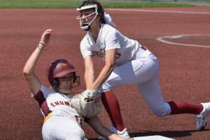 Enumclaw High and White River joined 14 other teams for the two-day District 3 fastpitch tournament that eventually sent six squads to the Class 2A state championships, to be played this week in Selah. Enumclaw won two games at the Regional Athletic Complex in Lacey and is state-bound; White River dropped two games and saw the season come to a close. In this photo, Enumclaw's Alyssa Neal is tagged out at third while trying to stretch a double into a triple; the positive note is that her hit pushed the Hornets' first run across the plate. Photo by Kevin Hanson