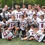 Photos by Kevin Hanson and Todd Overdorf / sonscapeimages.com/home
The Enumclaw High lacrosse team celebrates with a mid-field photo, moments after capturing the 1A/2A state championship. The Hornets took the title with a convincing victory over Orting at the Starfire complex in Tukwila. Pictured here, taken during Saturdays contest, are McCade Walker (#16) maneuvering past an Orting defender; and Colton Paulson diving toward the goal through three Orting players.