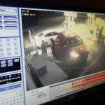 Pictured here is the moment right before the white car backed almost entirely into a local Chevron station, captured on security footage.