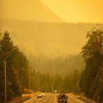 An emergency fire vehicle heads past a barricade and toward Index as numerous agencies attempt to contain the Bolt Creek fire on Saturday, Sep. 10, 2022, on U.S. Highway 2 near Index, Washington. (Photo by Ryan Berry / Sound Publishing)