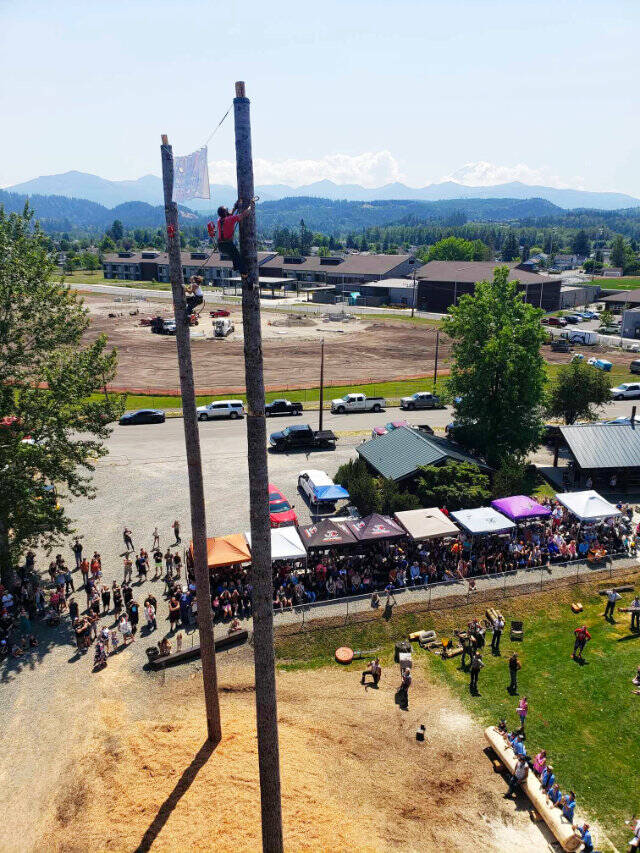 Its a race to the top! On the second pole, in the red, is BIlly Clinkingbeard, who won the event with a time of 37.19 seconds. Photo by Ray Miller-Still