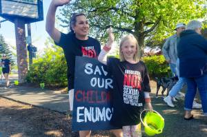 Jessica McCoy-Storton and her daughter Sadie at one of the Fill The Bucket Fridays that Save Our Children - Enumclaw hosted on the corner of Porter and Griffin. Photo by Ray Miller-Still
