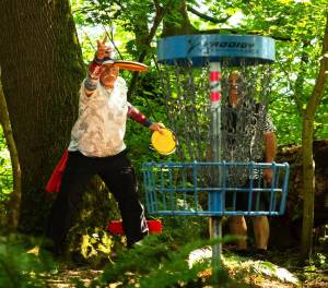 PHOTO COURTESY PRESTON BOYD 
Marty Smith finishes one of the Farmers Park holes with a short putt toward the basket.