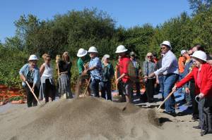 Black Diamond employees participating in a ceremonial groundbreaking at the location where the Lawson Hills Fire Station is set to be. Photo By Joshua Solorzano//Sound Publishing.