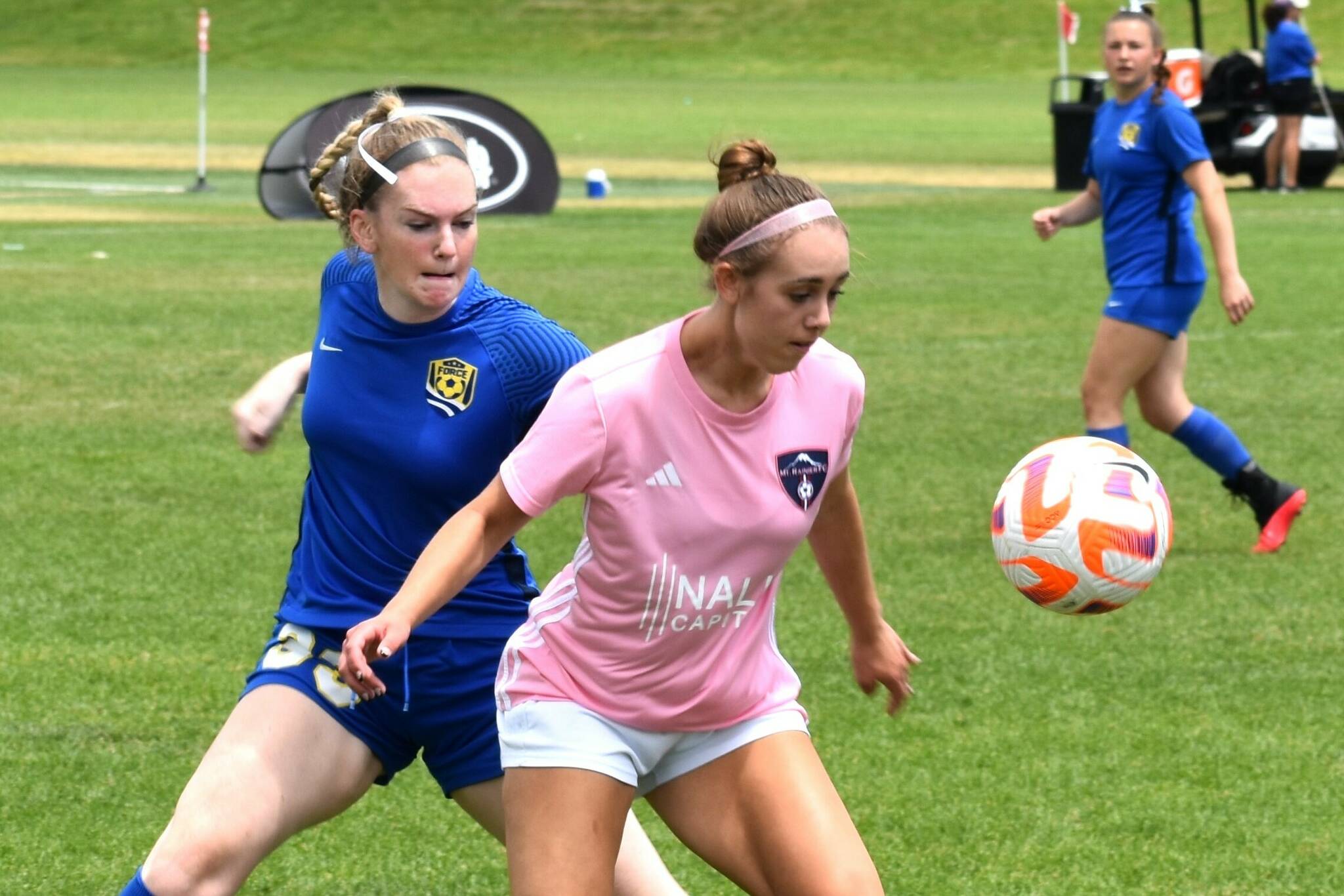 PHOTO COURTESY MIKE AVERY Anne Anderson looks to control a loose ball during a National Cup game.