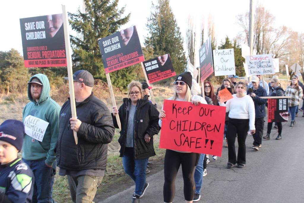 Local residents opposed to the transitional home for sex offenders, Garden House, and its resident Stevan Knapp celebrated when he was removed last July. Many people picketed Garden House in late February. Photo by Ray Miller-Still