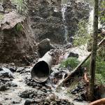 A debris flow this past November along Dry Creek overwhelmed a 24-inch culvert under SR 410 near Crystal Mountain Resort, causing water and about two feet of debris to cover the highway. It also caused scouring along the shoulder and embankment. Image courtesy Washington State Department of Transportation